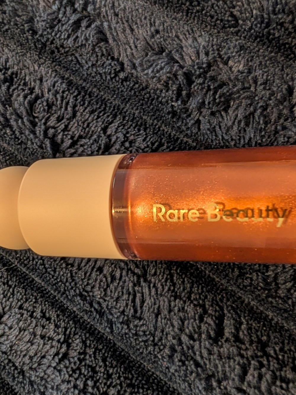 Rare Beauty illuminator in captivate - Copper Orange